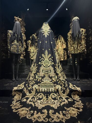 A gilt chapel setting and the clothing within nods to Italy’s Catholic traditions in "From the Heart to the Hands: Dolce&Gabbana," an exhibition at ICA Miami. (Photo by Jane Wooldridge)