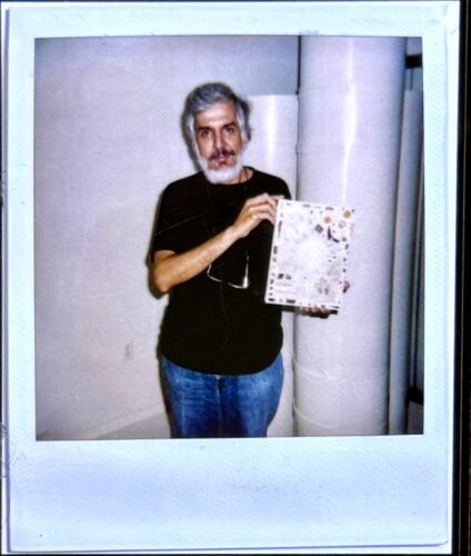 Salvator La Rosa holding "Untitled #, n.d." Polaroid.(Photo credit Kevin Arrow and Erin Parish)